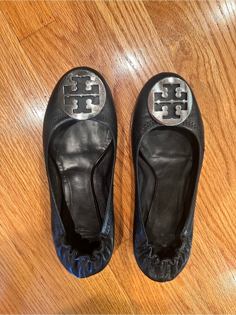 Tory Burch Black Leather Logo Ballet Flats with Silver Medallions